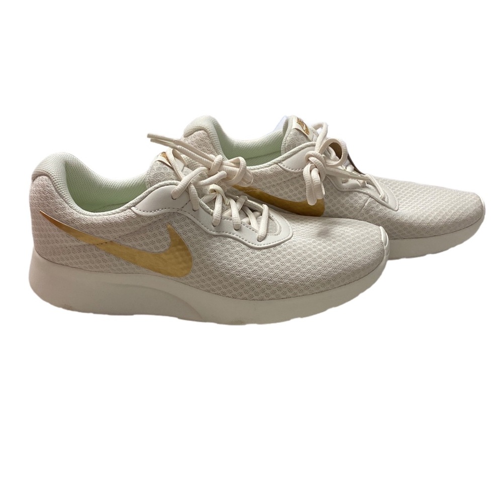 Nike Women's Sneakers in Cream with Gold Accents